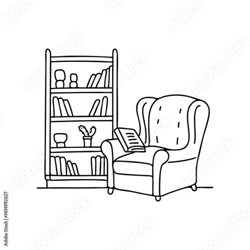 Recliner in front of a bookshelf with a book resting on the arm