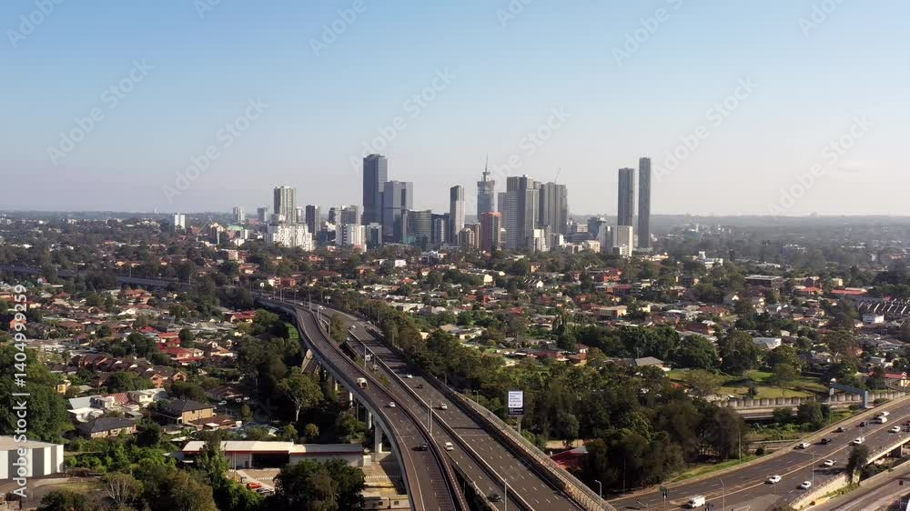 Western Sydney Parramatta city CBD skyline over M4 motorway – aerial flying 4k.
Western Sydney Parramatta city CBD skyline over M4 motorway – aerial flying 4k.