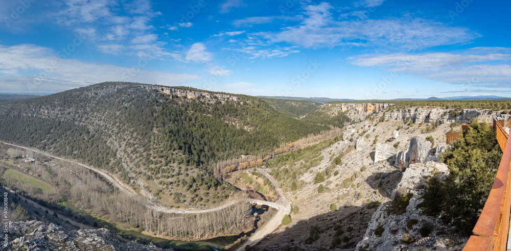 Scenic Mountain Valley with Lush Forests and River View