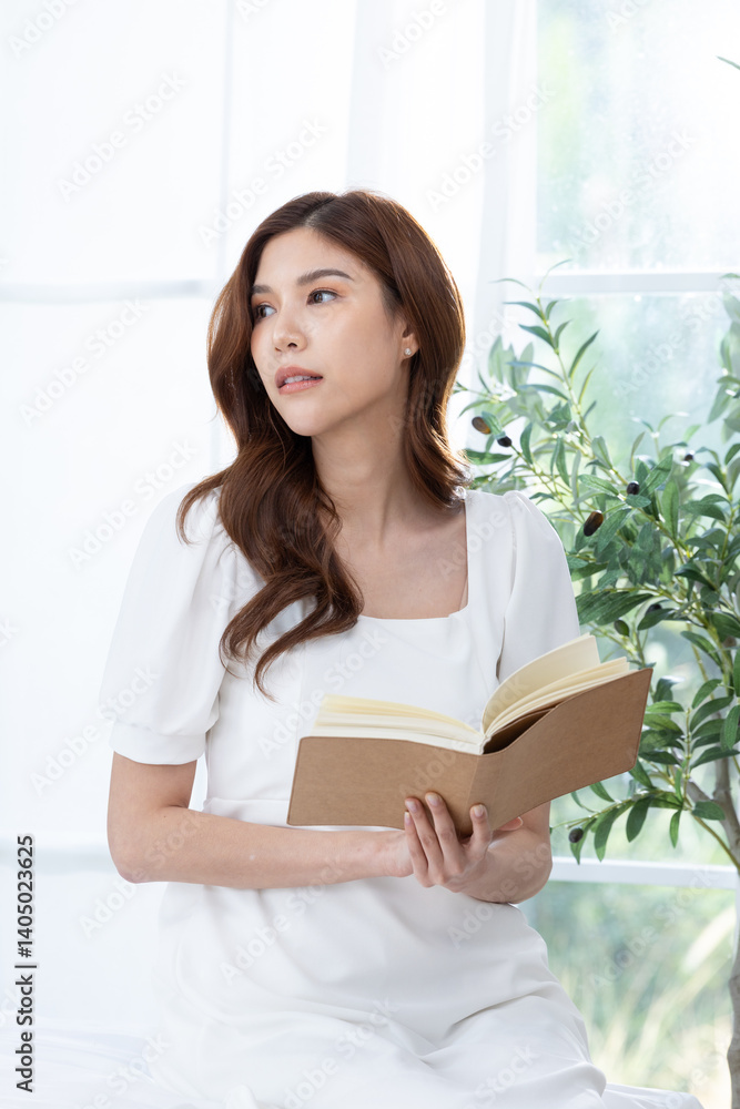 Young woman reading book in peaceful setting Young woman reading book in peaceful setting