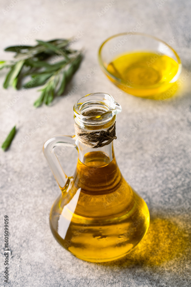 Organic olive oil in a jug on vintage background
