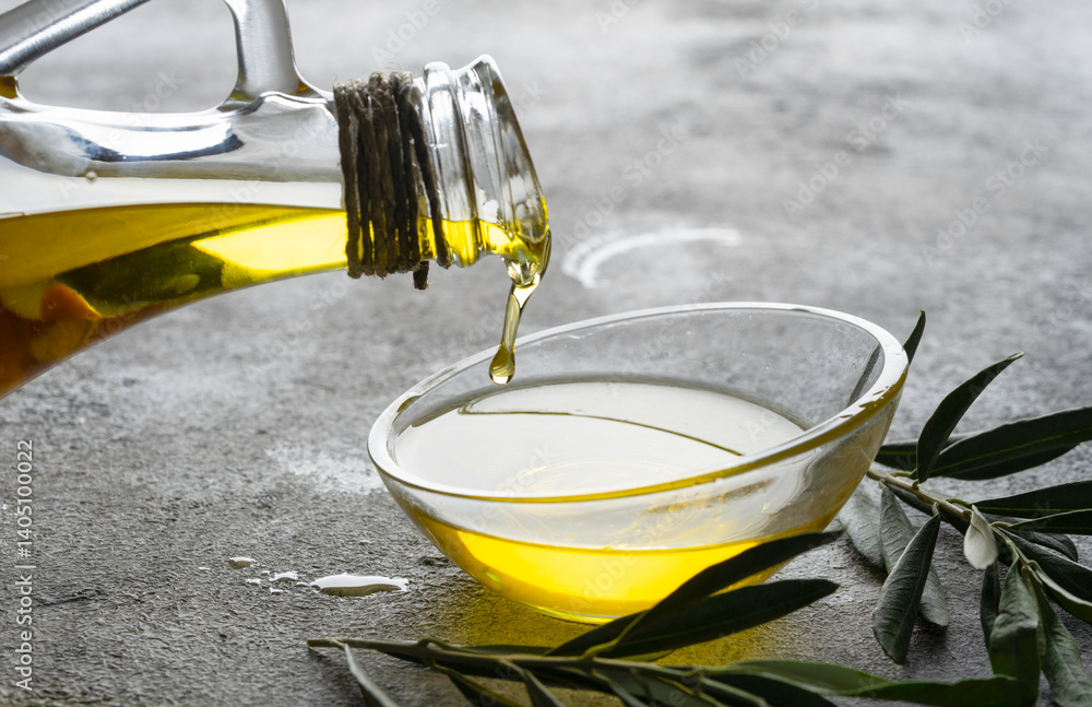 Organic olive oil in a jug on vintage background