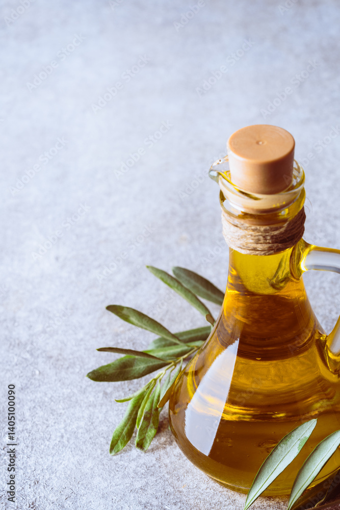 Organic olive oil in a jug on vintage background