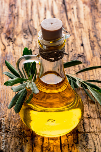 Obraz na płótnie Organic olive oil in a jug on wooden background w salonie