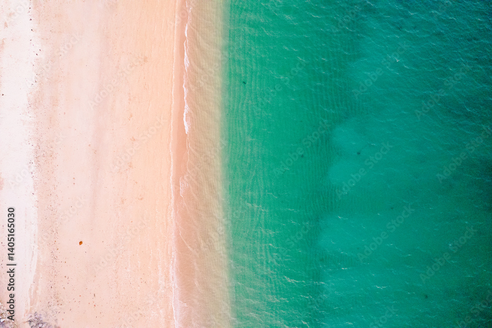 Fototapeta premium beach aerial view clear water shoreline coastal patterns, top down view aerial drone photo. Summer concept background