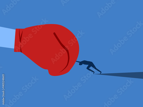 Businessman fights with giant boxing gloves