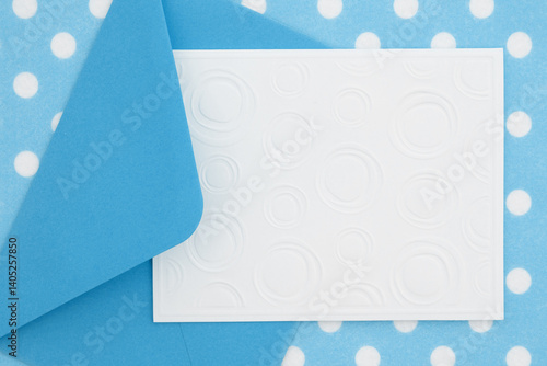 Obraz na płótnie Blank greeting card and envelope on blue polka dots material w salonie