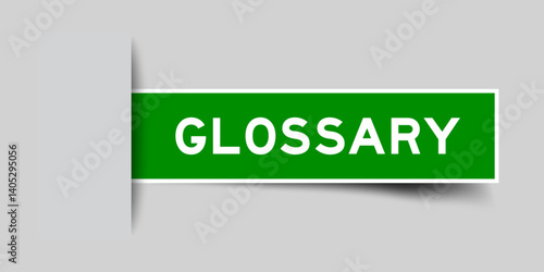 Green color square shape sticker label with word glossary inserted in gray background