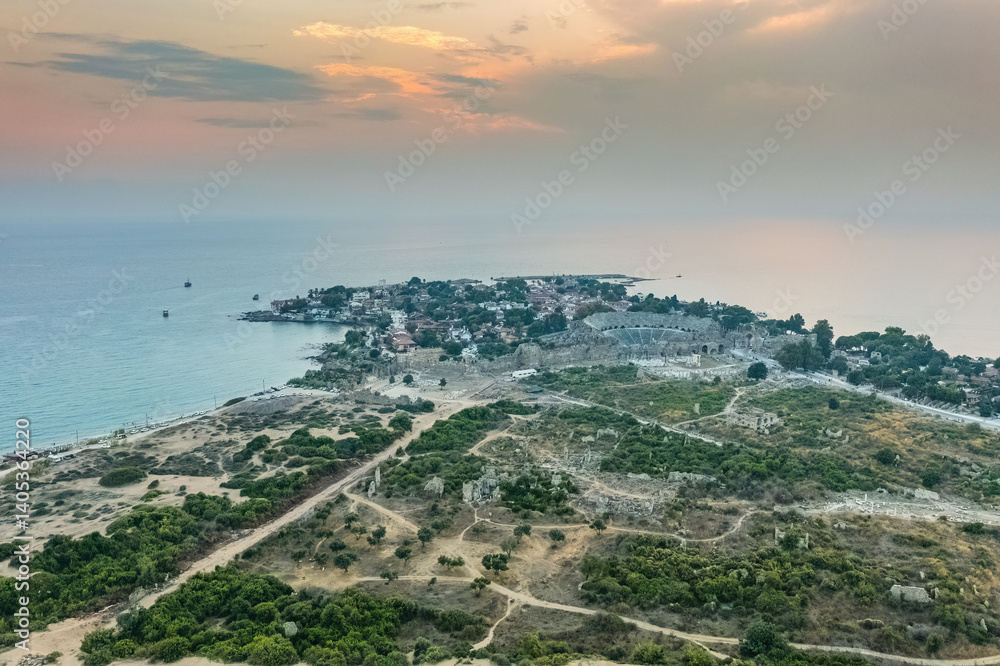 Side Ancient City in Antalya Province, Turkey. Aerial top drone view of the ancient Side town with amphitheater. Magnificent view.