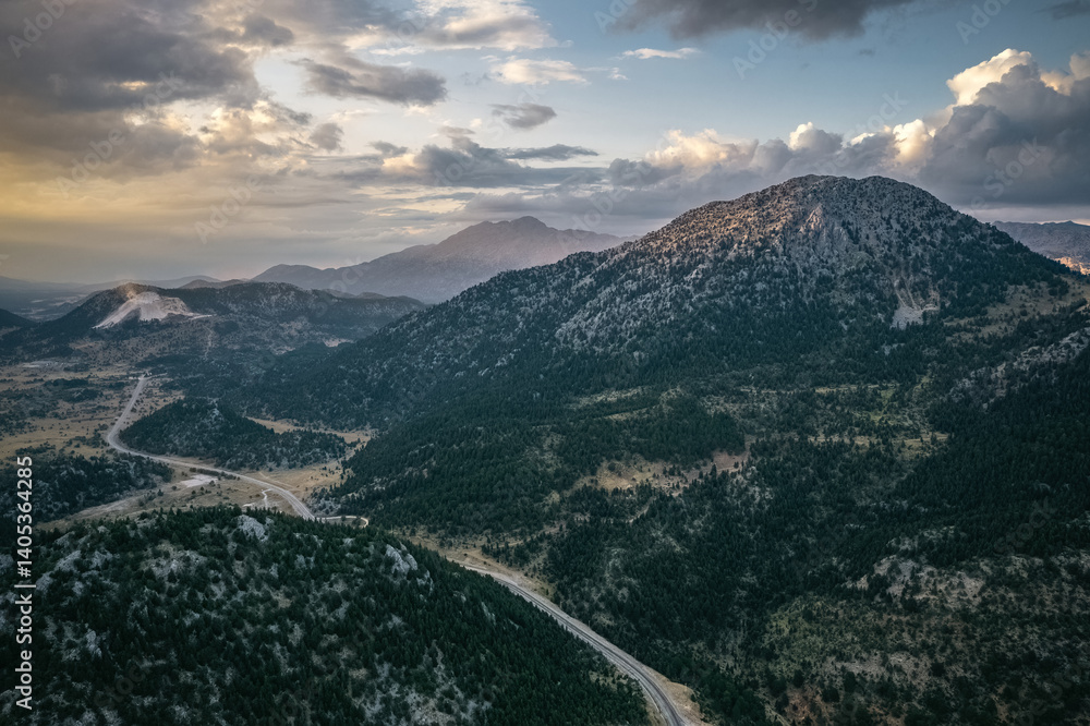 Large, impressive mountains covered with trees in the Akseki district of Antalya. Cloudy skies and unique natural scenery. Antalya, Turkey.