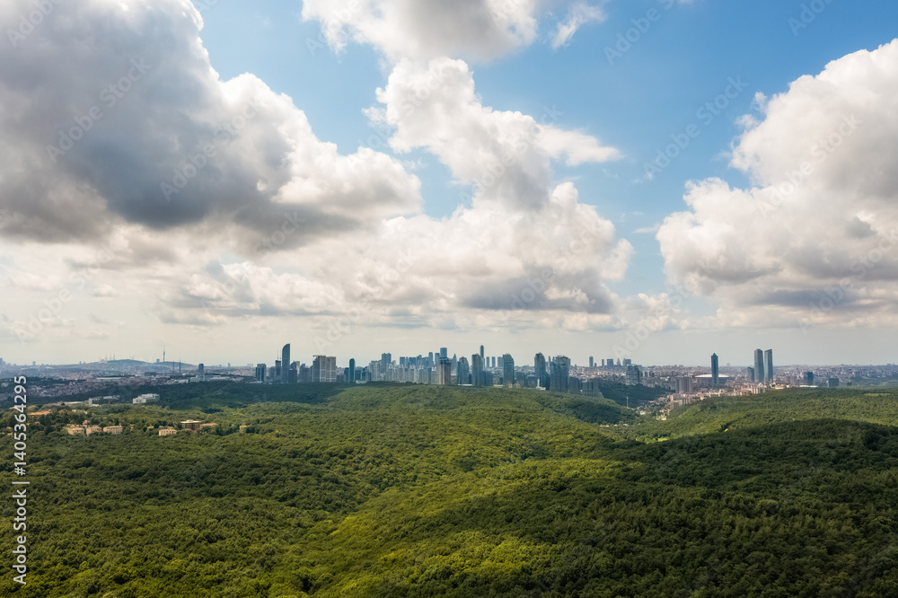 Istanbul city view. Residences view of lush green forest and sky covered with white clouds.