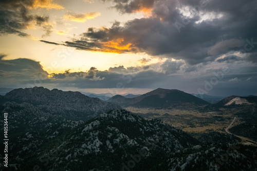 Obraz na płótnie The magnificent big mountains covered with trees in Akseki district of Antalya. The sun is illuminating the sky from between the clouds. w salonie