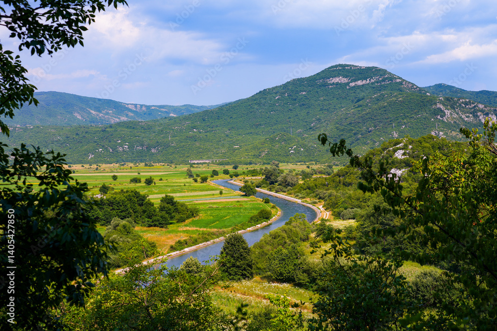 Zeta river flowing in the Bjelopavlići Valley near Niksic in a rural area of northern Montenegro