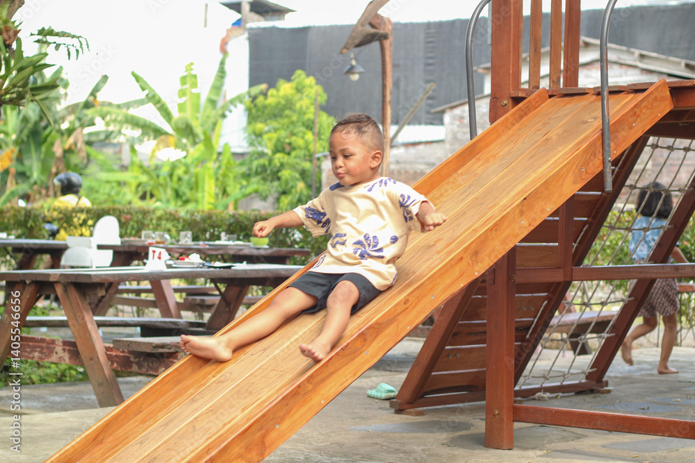 Asian child smiling playing on slider bar toy outdoor playground, happy preschool little kid having funny while playing on the playground equipment in the daytime in summer, Little boy climbing Asian child smiling playing on slider bar toy outdoor playground, happy preschool little kid having funny while playing on the playground equipment in the daytime in summer, Little boy climbing