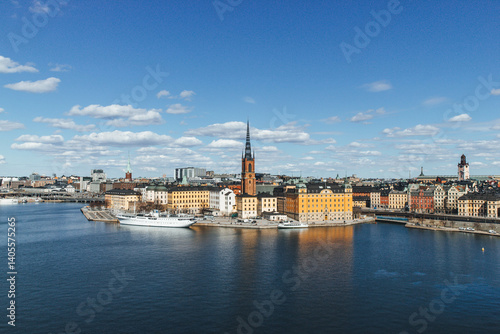 Photography panorama of stockholm on beautiful sunny day with water reflections and clouds