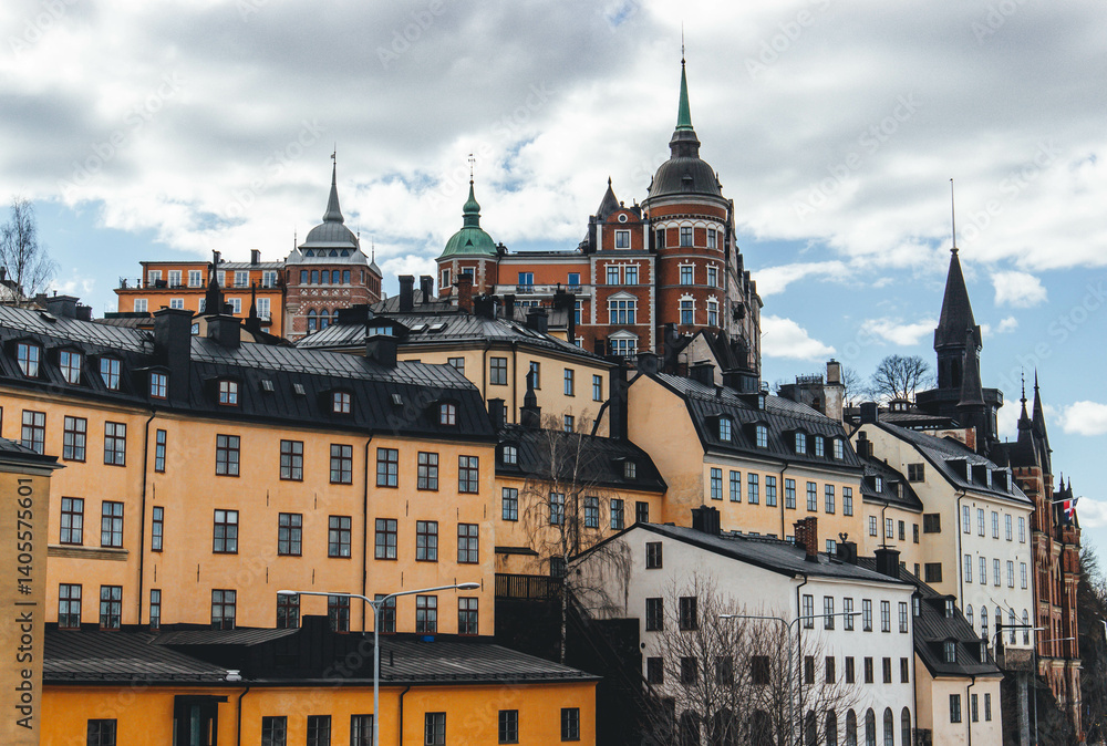 Fototapeta premium panorama of stockholm on beautiful sunny day with water reflections and clouds