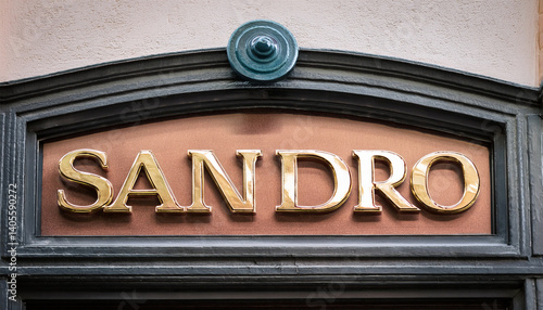 sandro sign text shop and logo brand store chain on wall facade entrance on fashion clothing