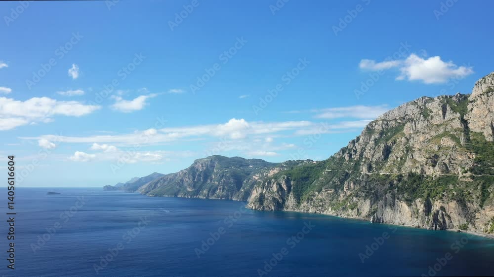 The mountainous reliefs bordering the Tyrrhenian Sea in Europe, in Italy, in Campania, in summer, on a sunny day. The mountainous reliefs bordering the Tyrrhenian Sea in Europe, in Italy, in Campania, in summer, on a sunny day.
