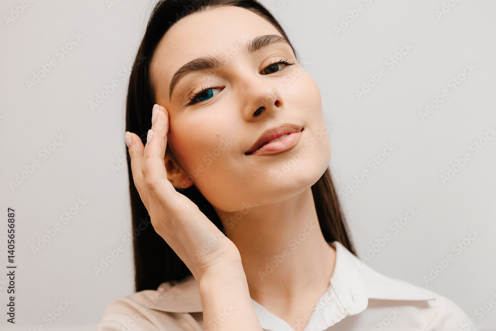 Girl in blue contact lenses with heterochromia with different color of the eyes iris. Heterochromia of eyes of girl in colored contact lenses on white background. Girl in blue contact lenses with heterochromia with different color of the eyes iris. Heterochromia of eyes of girl in colored contact lenses on white background.