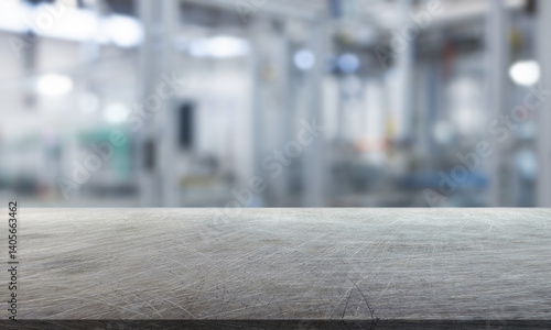 abstract blurred background and empty steel tabletop in foreground. Business presentation