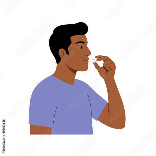 Man and Pill: A man takes a medication in form of pill, showing a common scene of self-care.