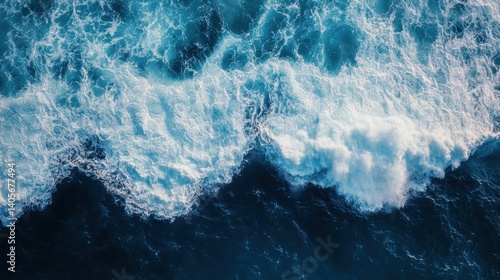 Fototapeta Naklejka Na Ścianę i Meble -  Spectacular aerial top view background photo of ocean sea water white wave splashing in the deep sea. Drone photo backdrop of sea wave in bird eye waves.