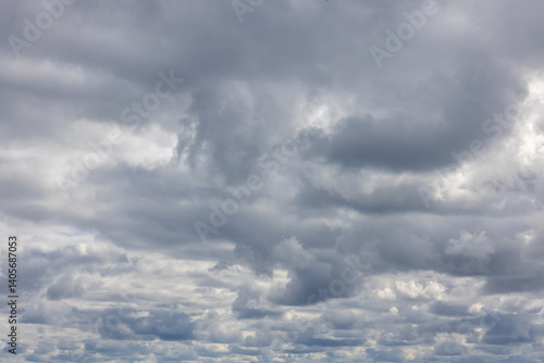 Photography Photo of gloomy stratocumulus cloudscape patchy honeycomb like gray ands white clouds