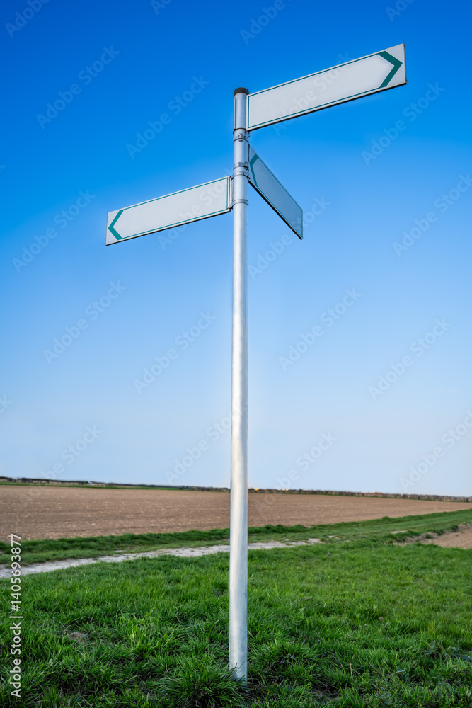 Fototapeta premium white road sign with three plates indicating directions in different directions