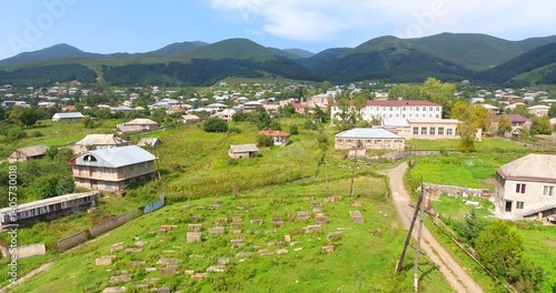 Drone rising over St. Gregory the Illuminator Church in Margahovit with a view of village