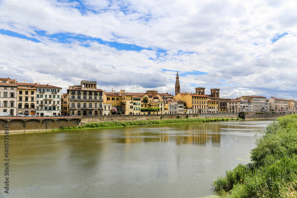 A river runs through a city Florence with a bridge over it A river runs through a city Florence with a bridge over it