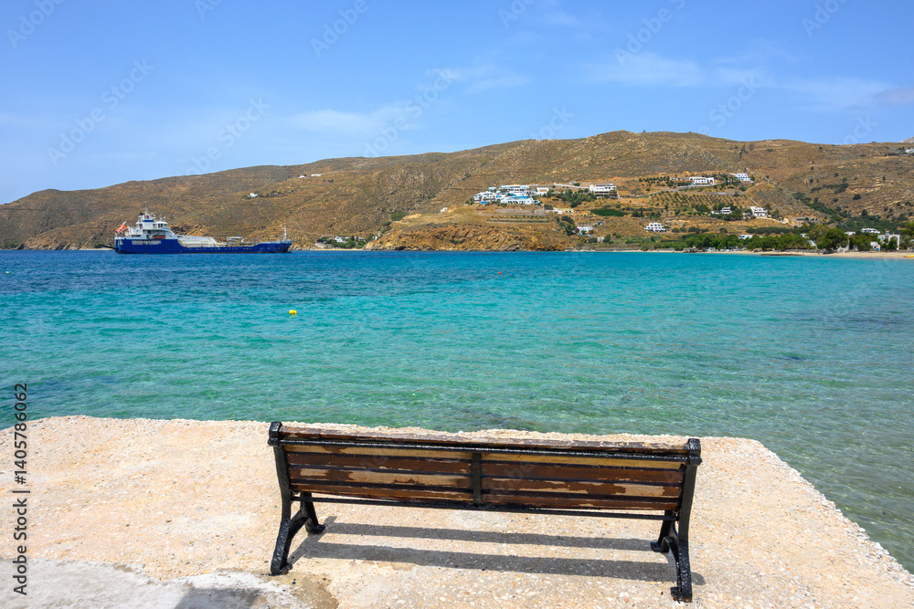 A bench overlooking the bay of Aegiali. The northern part of Amorgos island. Greece