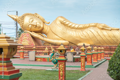 Reclining Buddha statue at Wat That Luang Tai in Vientiane, Laos — a symbol of peace, enlightenment, and Southeast Asian Buddhist heritage
