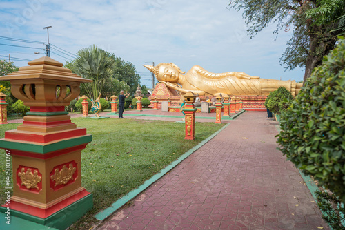 Reclining Buddha statue at Wat That Luang Tai in Vientiane, Laos — a symbol of peace, enlightenment, and Southeast Asian Buddhist heritage