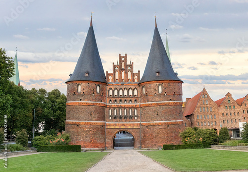 An old castle style brick building with tower turrets and spires