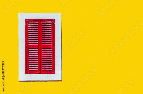 Obraz na płótnie Minimalist style photo of yellow wall with red window in white frame, Murano, Venice, Italy w salonie