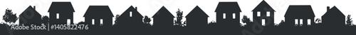 A decorative silhouette design of various houses creating a neighborhood scene.