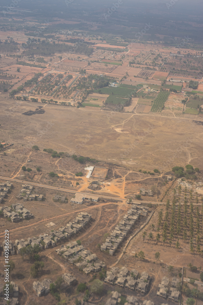 India, Karnataka, Bangalore, Aerial view of city outskirts in the day from an aeroplane window