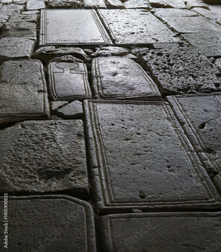 The medieval tombstones on the floor of old monastery in Armenia