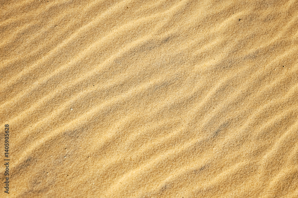 Sand texture closeup with natural ripple pattern on surface. Ideal for nature, travel, eco-friendly and minimalist design projects Sand texture closeup with natural ripple pattern on surface. Ideal for nature, travel, eco-friendly and minimalist design projects