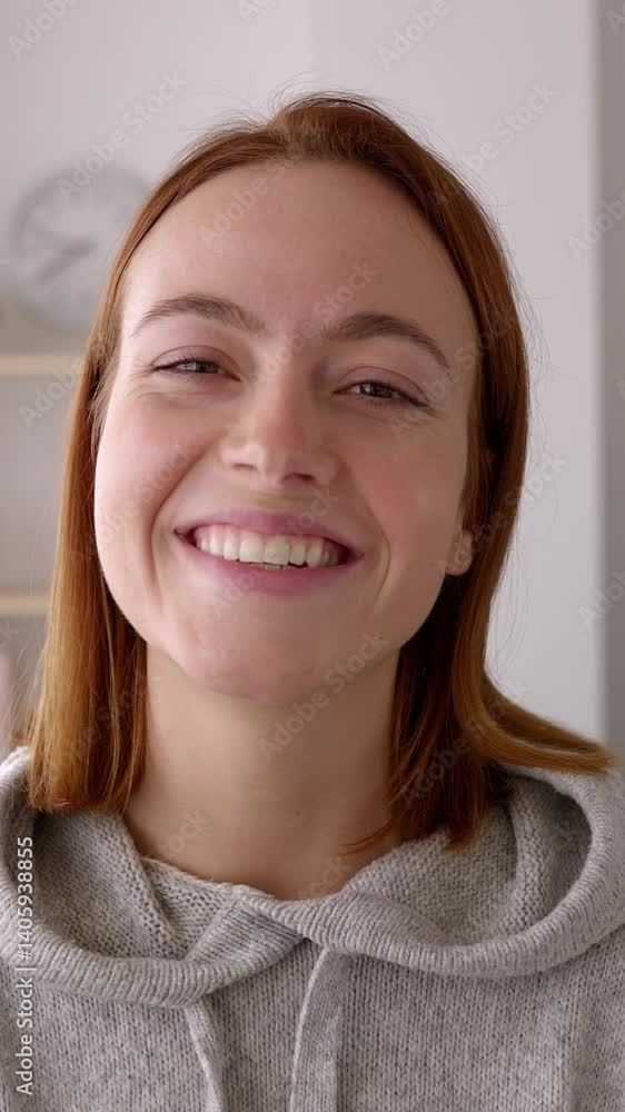 Vertical HD video of joyful portrait of young businesswoman smile at camera standing at workplace. Small business female owner feeling satisfied looking at camera from showroom office. Vertical HD video of joyful portrait of young businesswoman smile at camera standing at workplace. Small business female owner feeling satisfied looking at camera from showroom office.