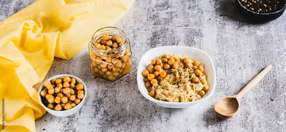 Vegetarian spicy chickpea hummus in a bowl on the table web banner