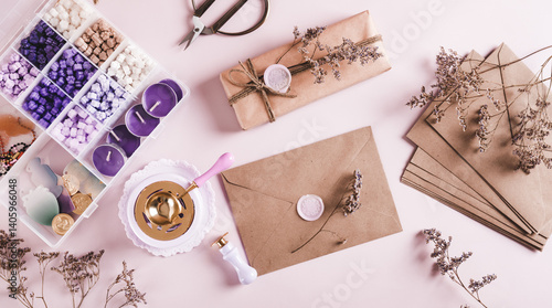 Creative set for sealing envelopes and gifts with wax seal on pink top view web banner