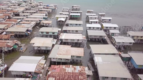 Aerial drone shot of Hanuabada village in Capital City Port Moresby, Papua New Guinea. Koki Stilt village. Motu tribe. Plenty of garbage everywhere. High quality 4k footage