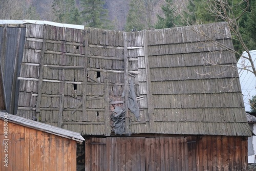 Obraz na płótnie Close-up of an old sloping roof with damaged wooden tiles w salonie