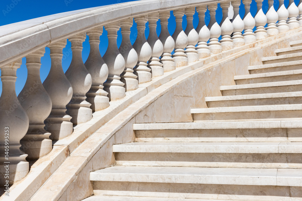 A stone staircase with a beautifully designed balustrade