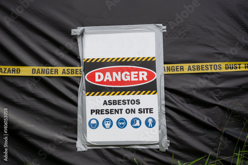Asbestos danger hazard sign, building site, warning house demolition fire, asbestosis lung cancer risk