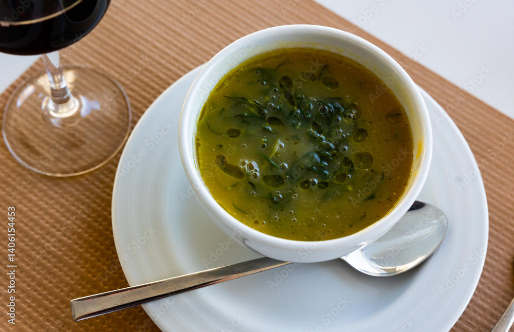 Portion of fresh caldo verde, traditional dish of Portuguese cuisine. Portion of fresh caldo verde, traditional dish of Portuguese cuisine.