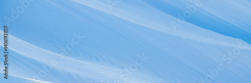 Obraz na płótnie Snow texture. Wind sculpted patterns on snow surface. Wind in the tundra and in the mountains on the surface of the snow sculpts patterns and ridges. Arctic, Polar region. Winter panoramic background. w salonie