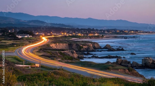 Coastal highway with vehicles captured in motion blur, emphasizing scenic road travel
