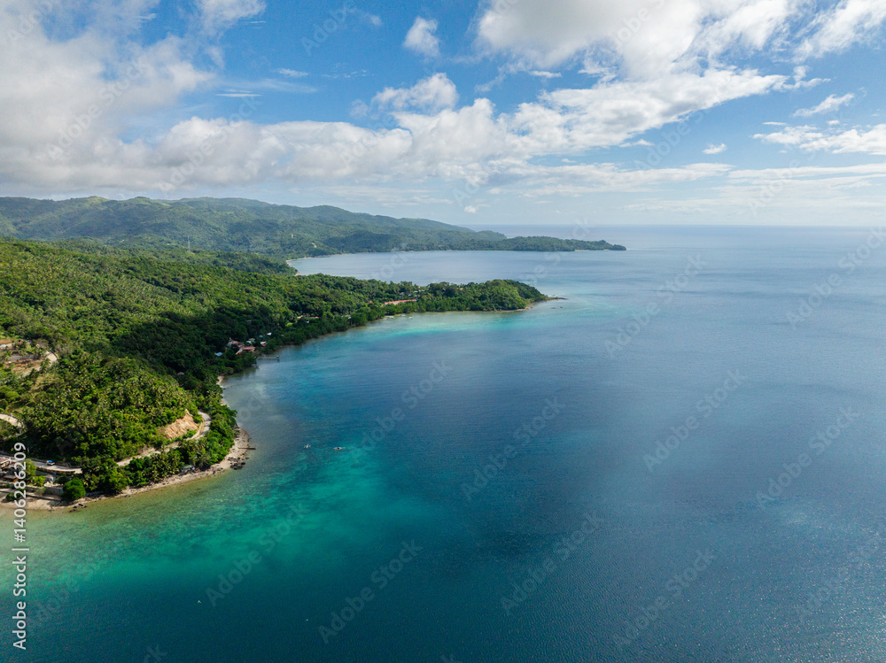 Fototapeta premium Coastline with beaches and blue sea in Alad Island. Romblon, Philippines.